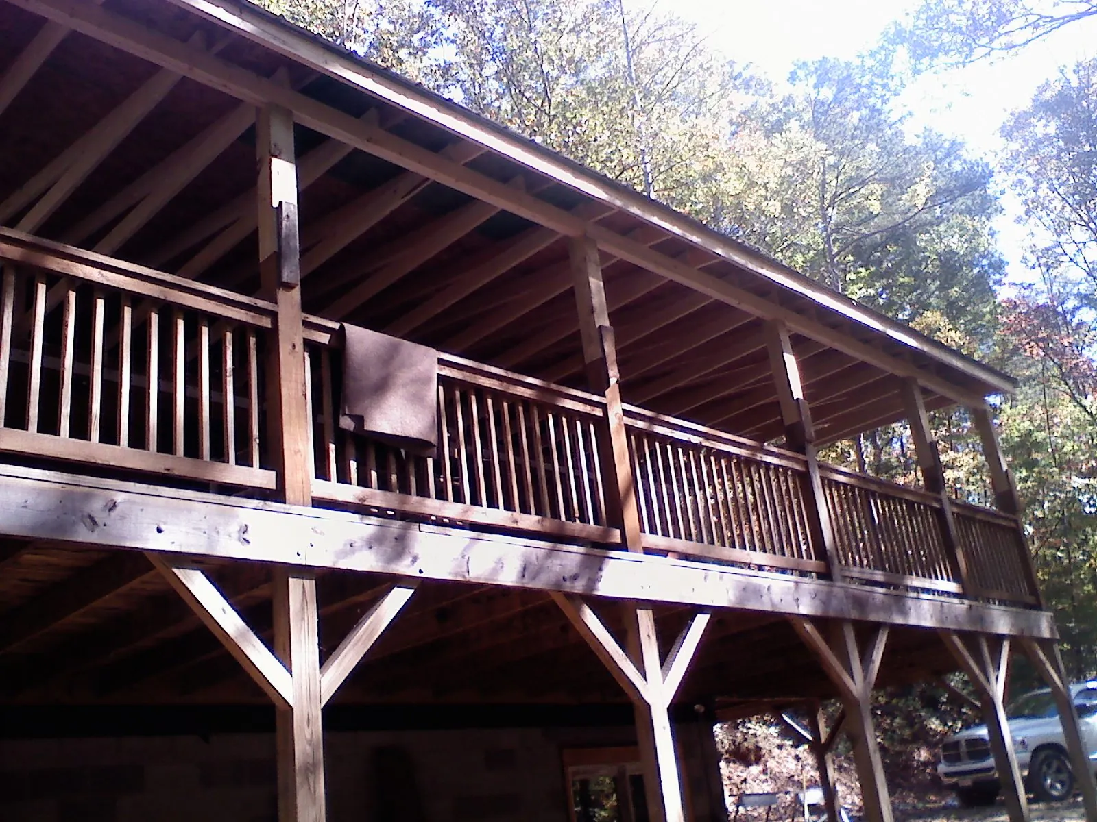 Timber framing under a new elevated porch and deck — Roof Leak Repair in Glasco by Roofing Brothers